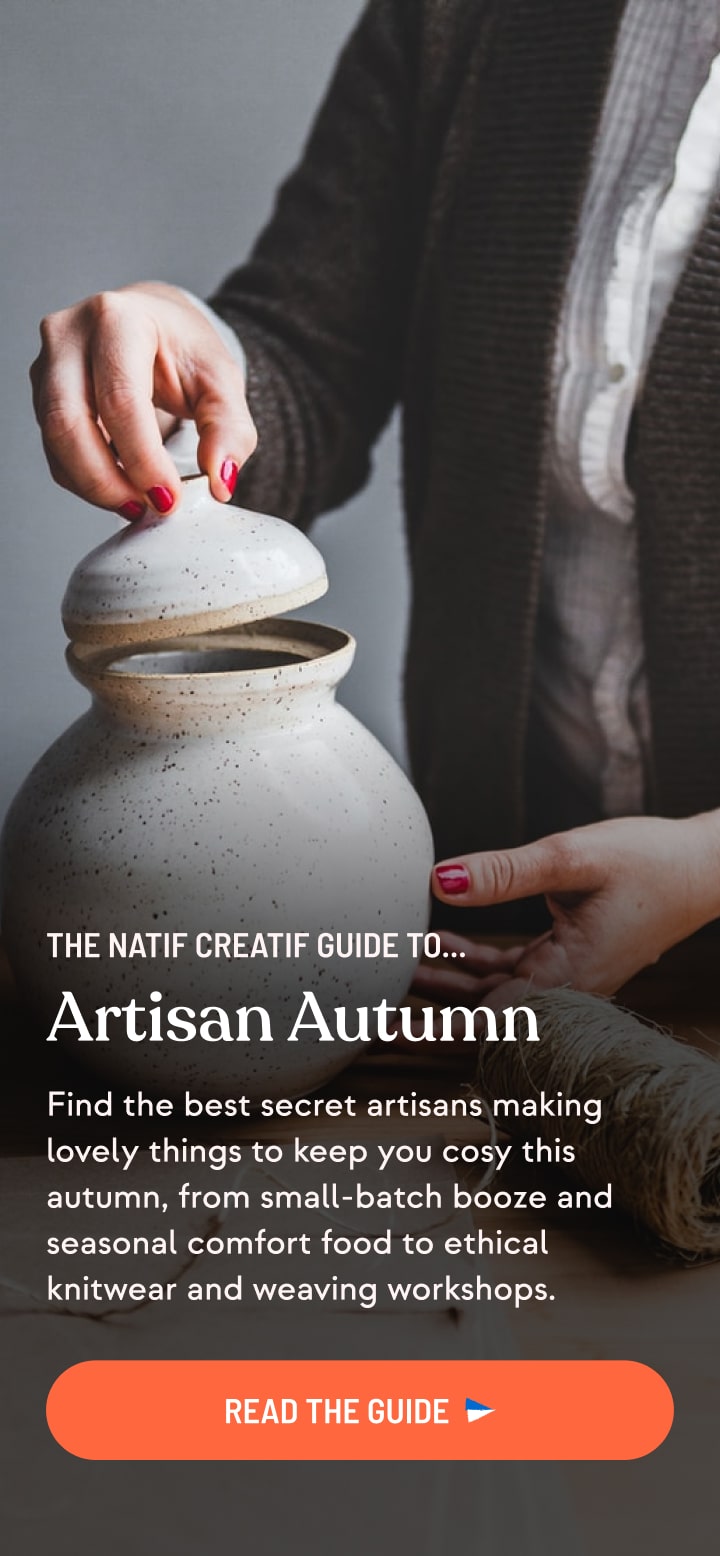 The front page of a guide to 'Artisan Autumn', running on a smartphone-sized screen. In the background there's an image of a woman's hands holding a rough clay pot.